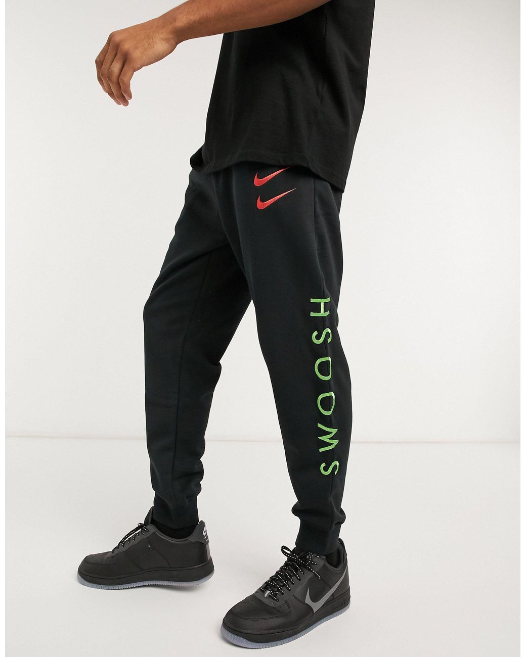 Nike Swoosh Cuffed Sweatpants in Black for Men | Lyst