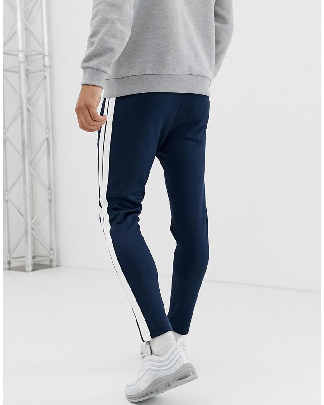 Navy blue joggers cheap with white stripe