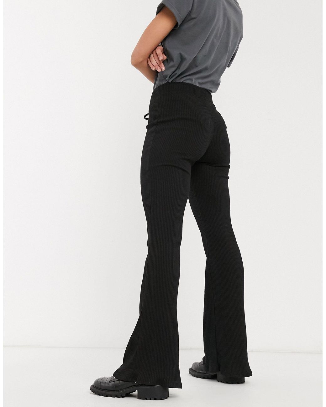 Bershka Ribbed Flared Pants With Tie Up Detail in Black | Lyst UK
