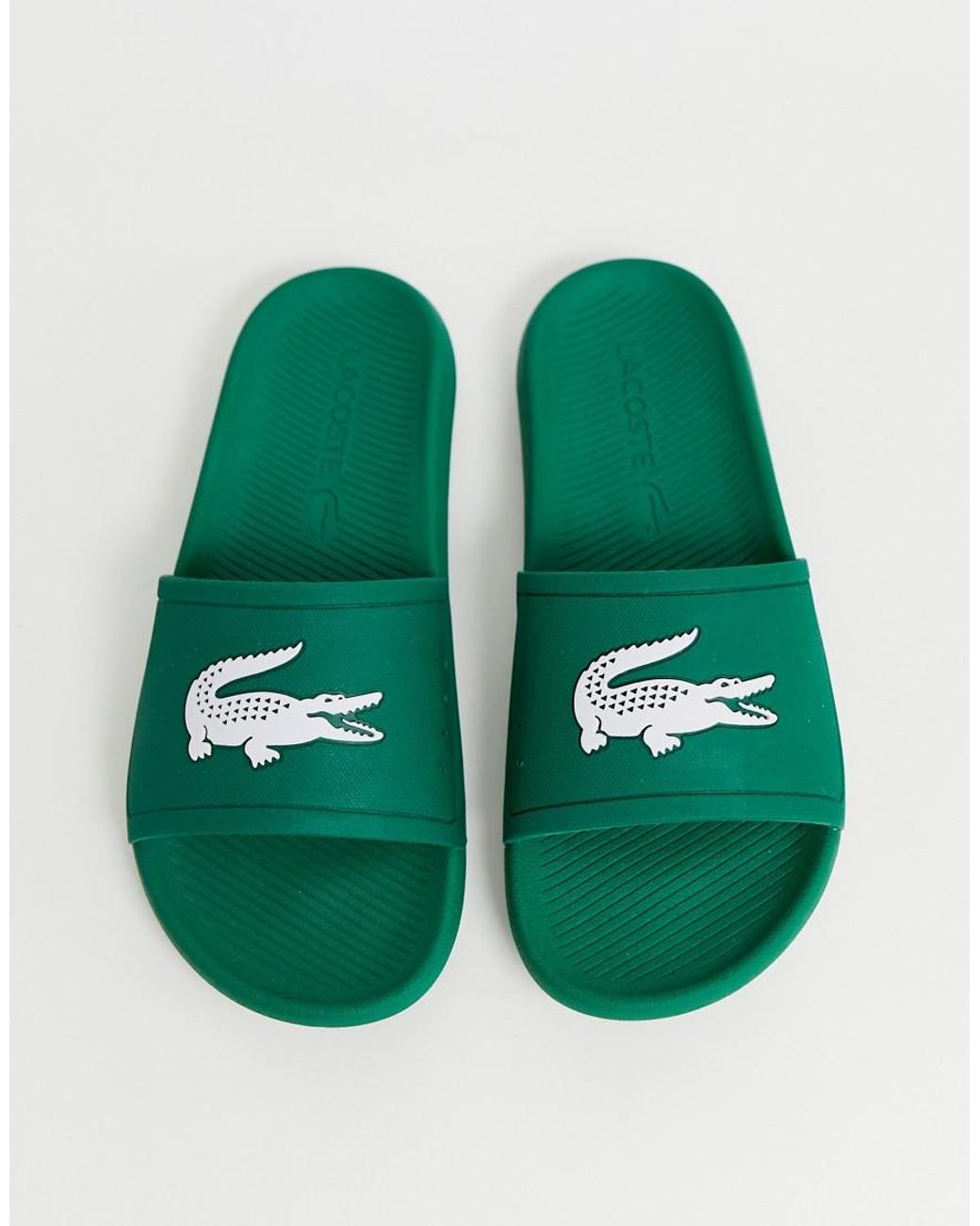 lacoste green flip flops