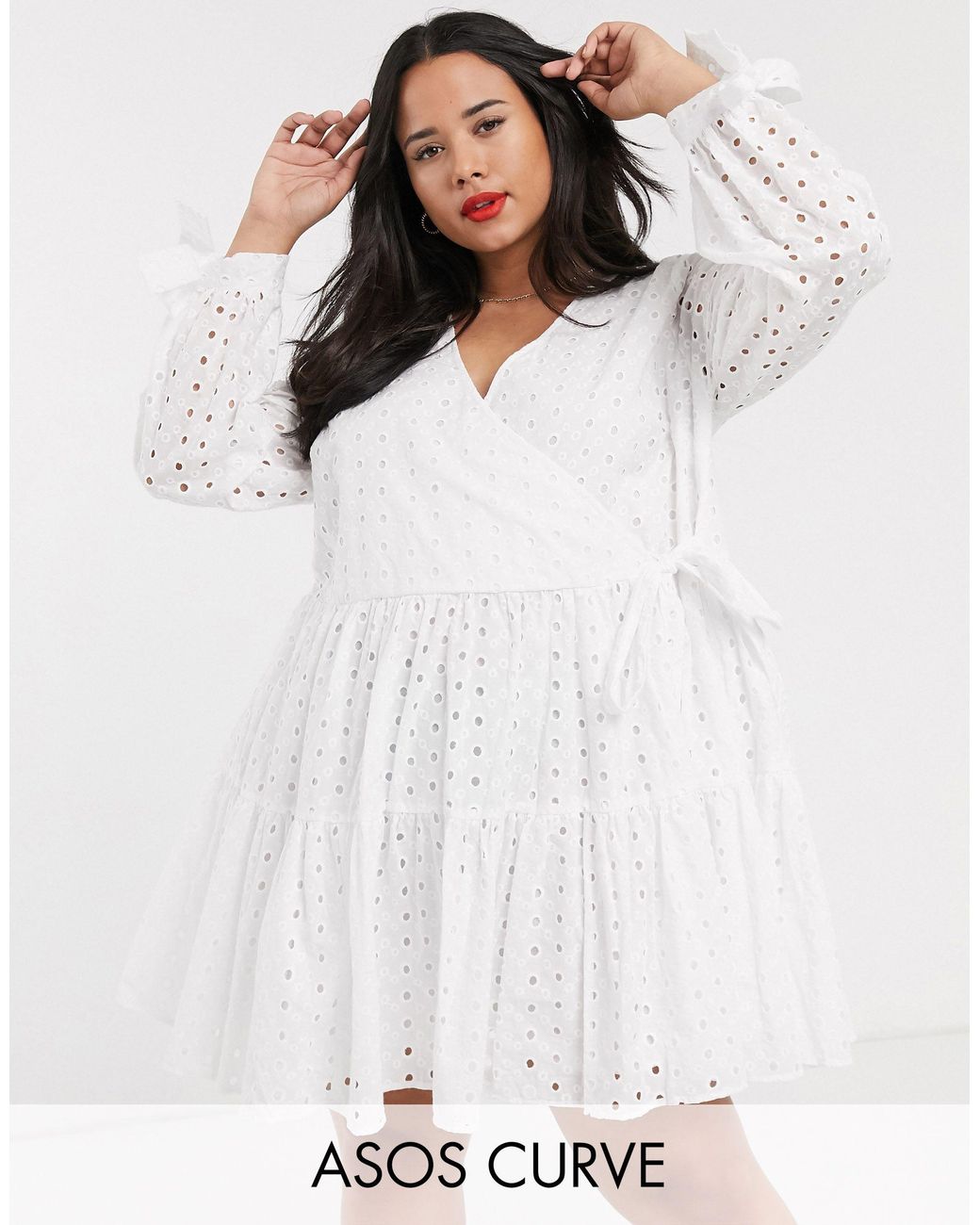 asos design petite tiered trapeze mini dress in broderie
