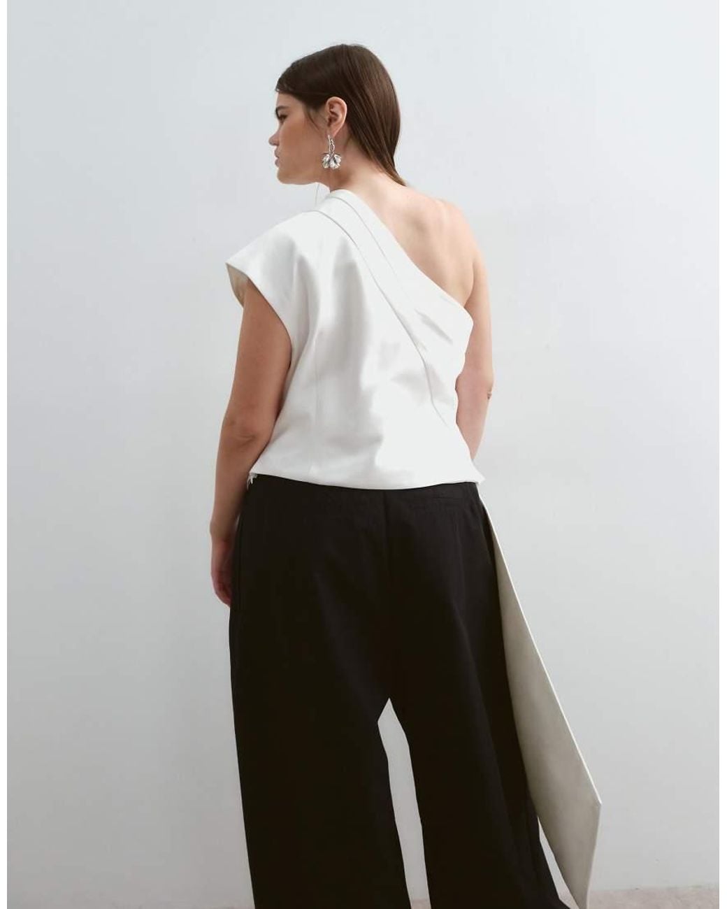 ARRANGE Black Curve One Shoulder Drape Top