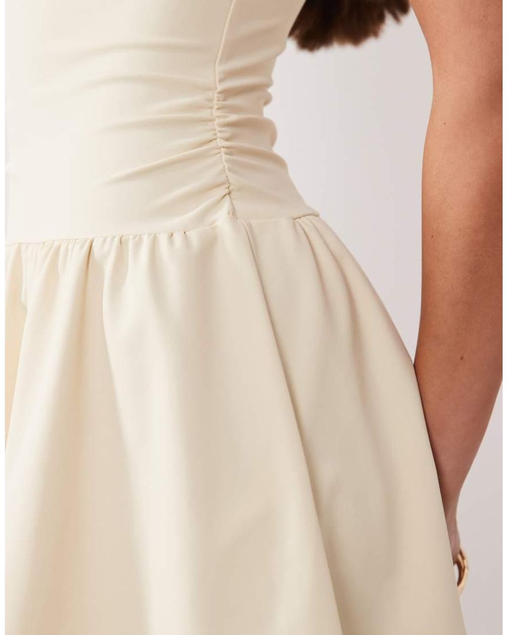 The Frolic Natural Exclusive Slinky Jersey Ruched Side Detail Flippy Hem Mini Dress