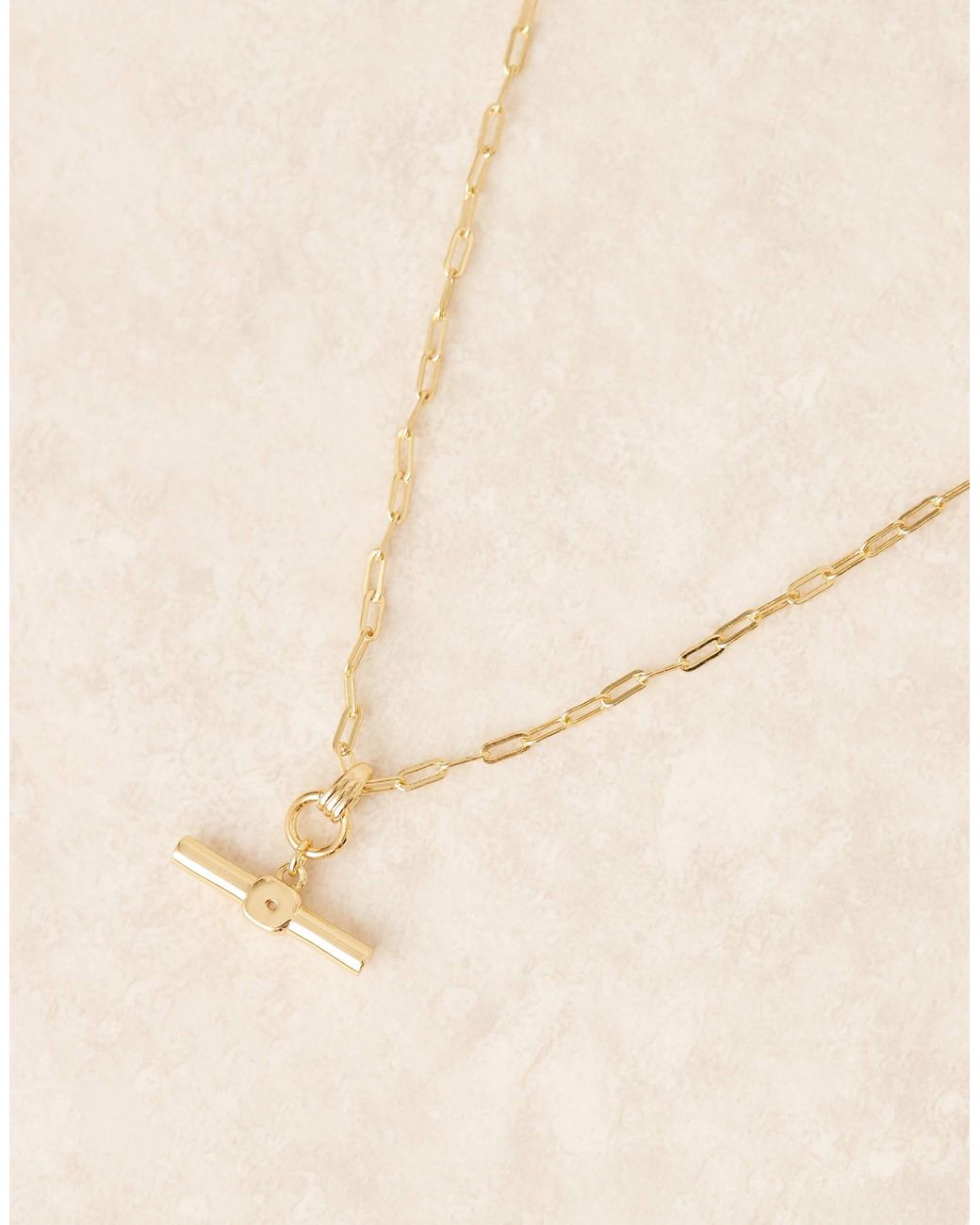 Z - collier en plaqué or 14 carats à pendentif barre en t Accessorize en coloris Brown