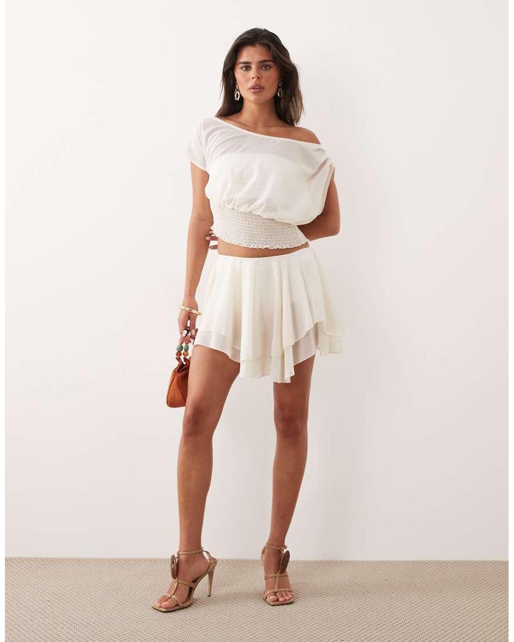 The Frolic Natural Exclusive Chiffon Drape Off Shoulder Shirred Waist Top