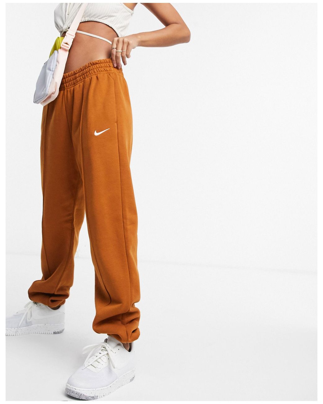 nike mini swoosh oversized tracksuit in earth brown