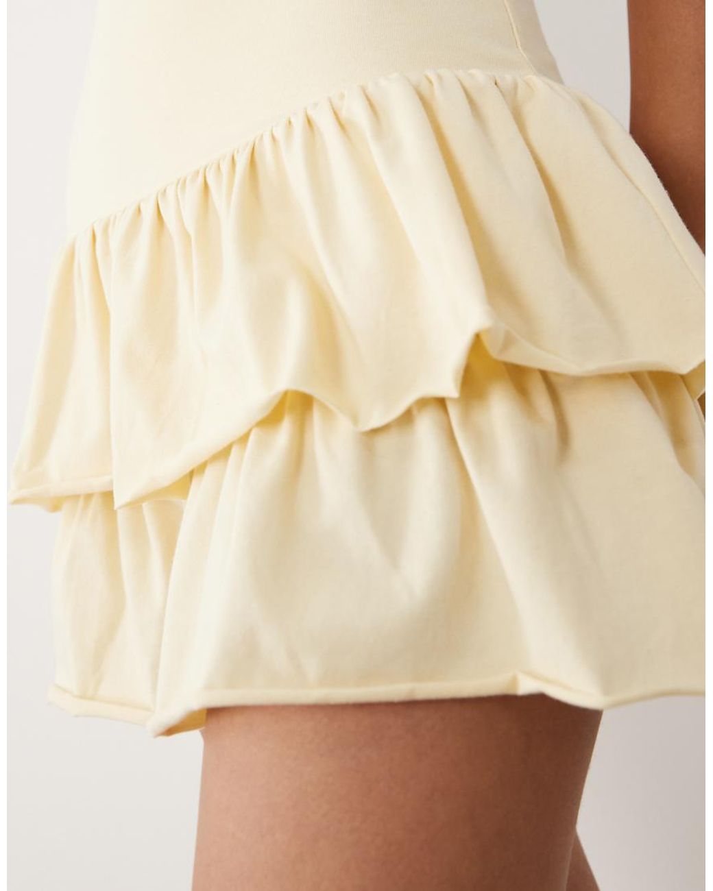 Fashionkilla Natural Exclusive Cotton Rich Sleeveless Drop Waist Ruffle Hem Mini Dress