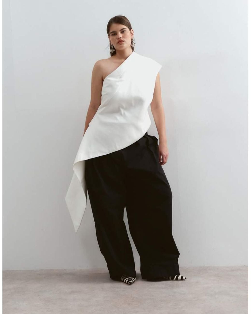 ARRANGE Black Curve One Shoulder Drape Top