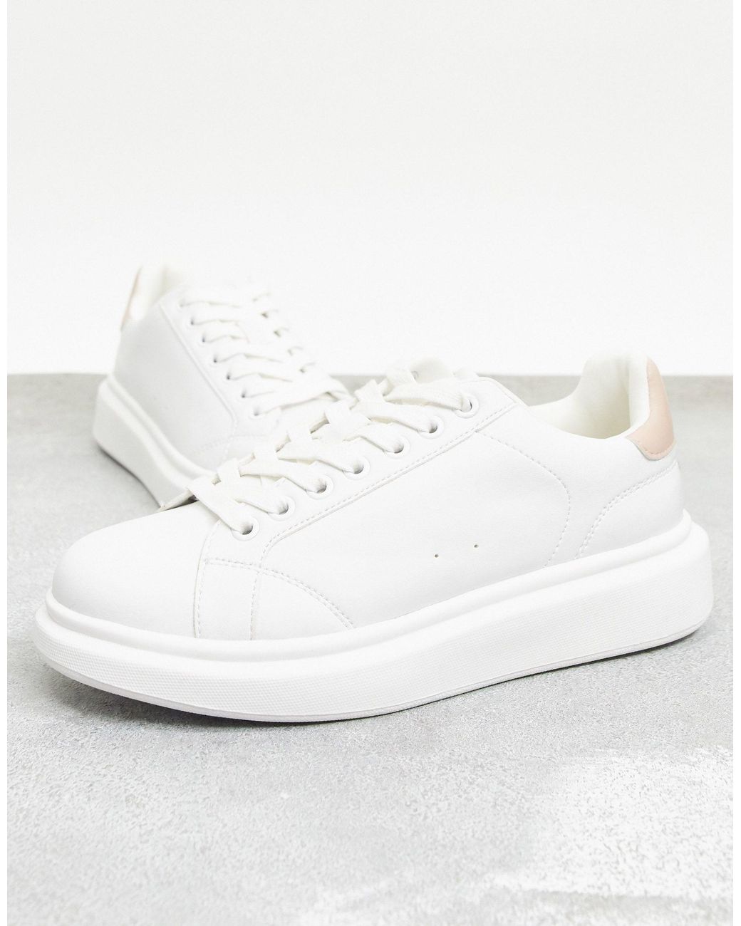 white flatform trainers