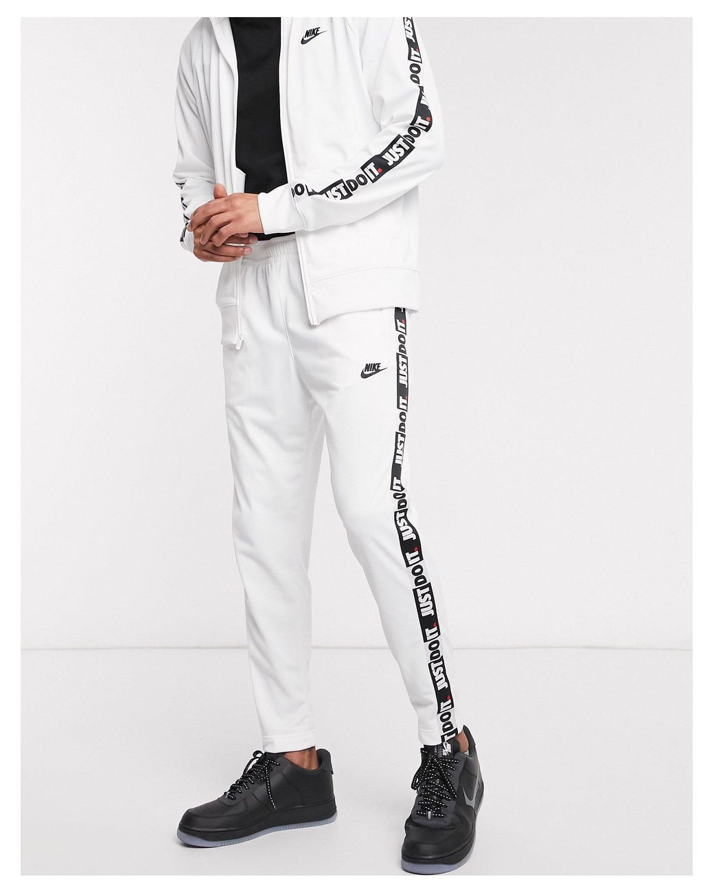 Nike Just Do It Taping Cuffed Sweatpants For Men Lyst