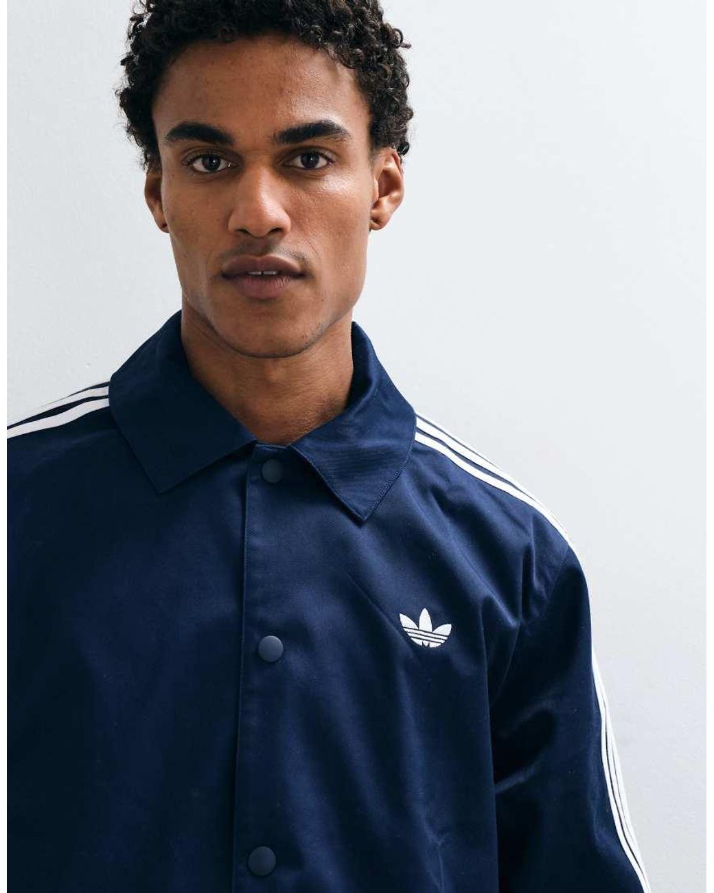 Adidas Originals Blue Three Stripe Coach Jacket for men