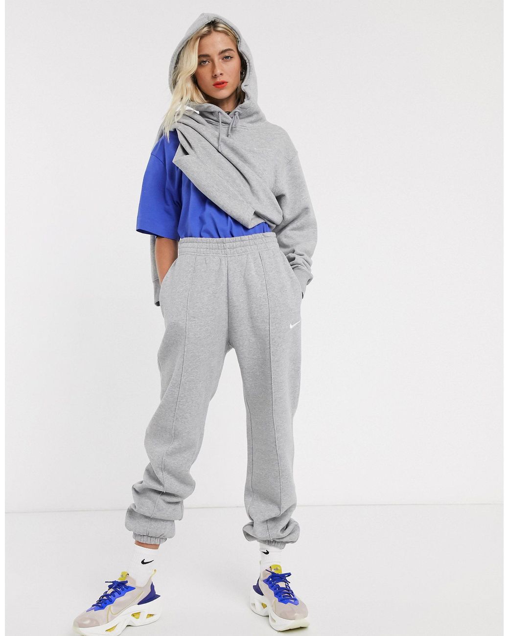 nike mini swoosh oversized yellow joggers
