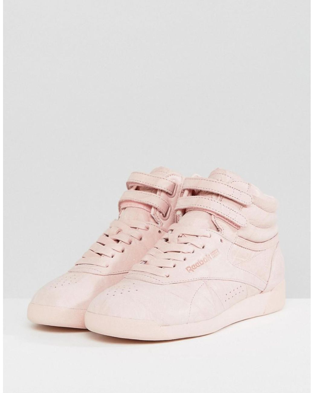 Reebok Freestyle Nubuck High Top Sneakers in Pink | Lyst UK