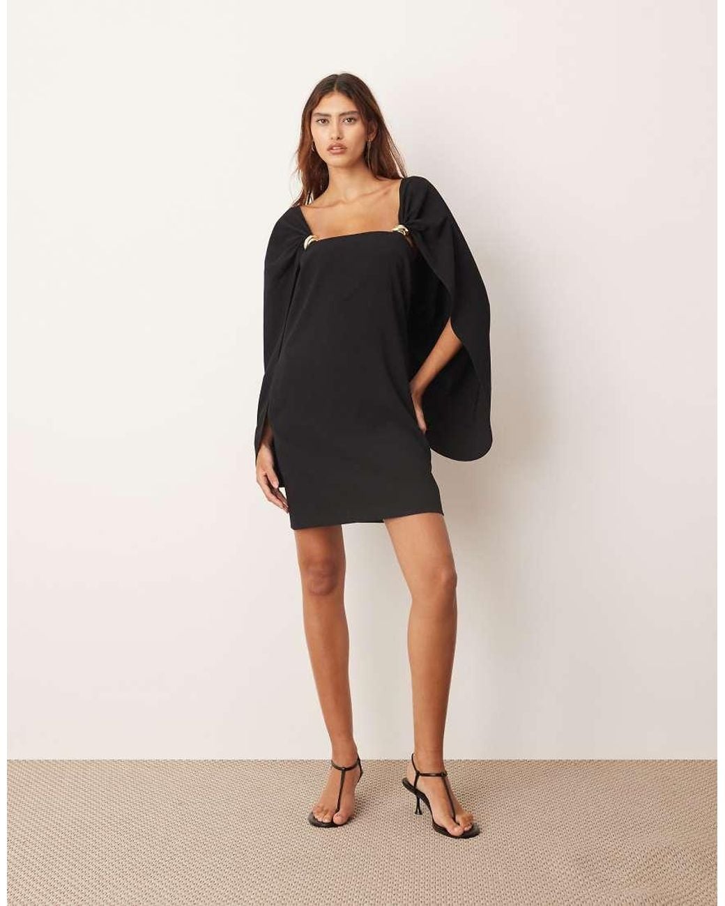 ARRANGE Black Cape Sleeve Mini Shift Dress With Metal Trim Detailing