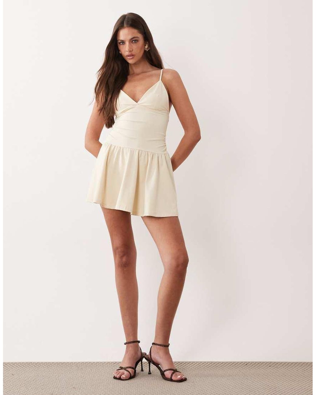 The Frolic Natural Exclusive Slinky Jersey Ruched Side Detail Flippy Hem Mini Dress