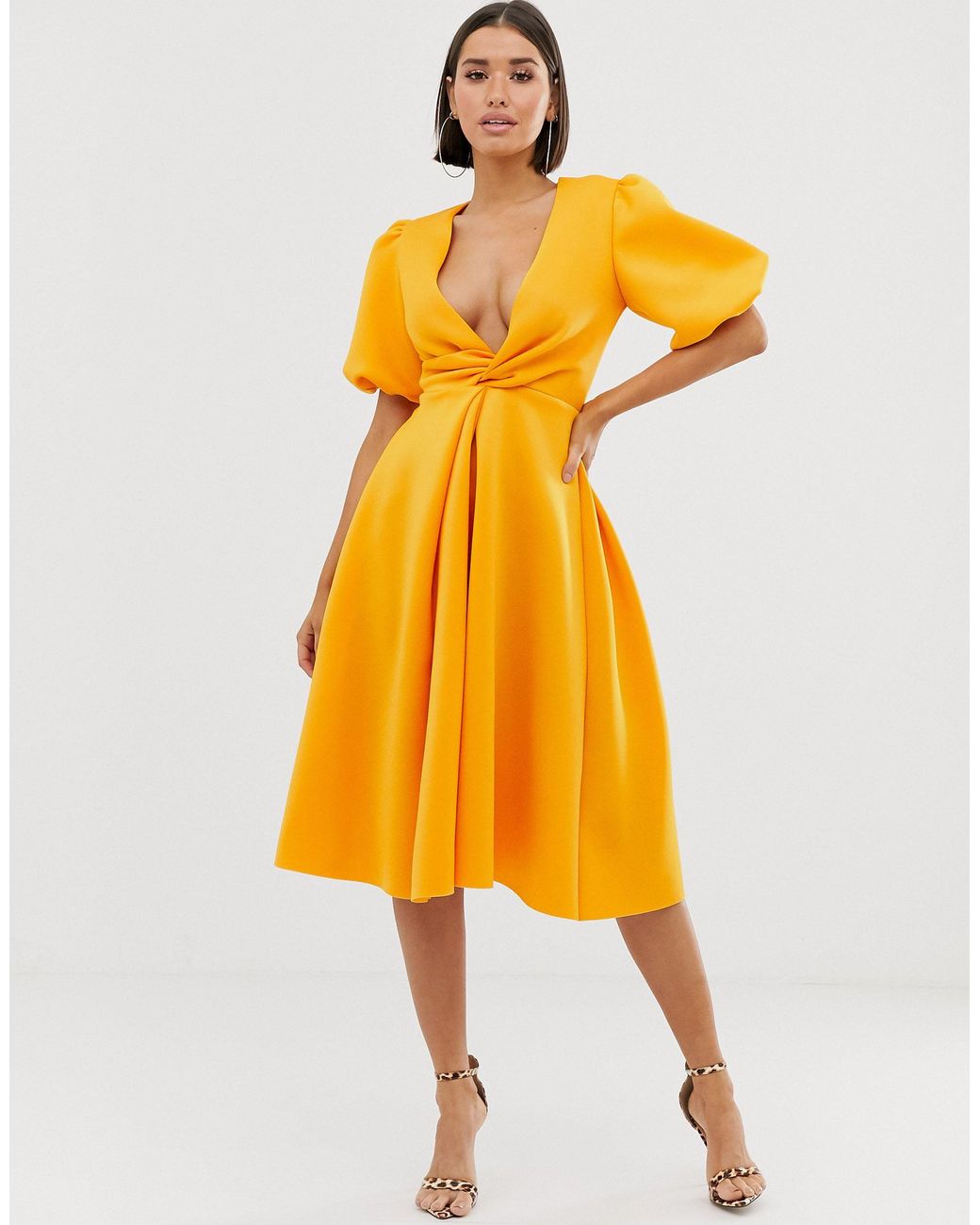 asos design bubble sleeve twist detail midi prom dress ASOS DESIGN twist front flutter sleeve midi tea dress in green floral print