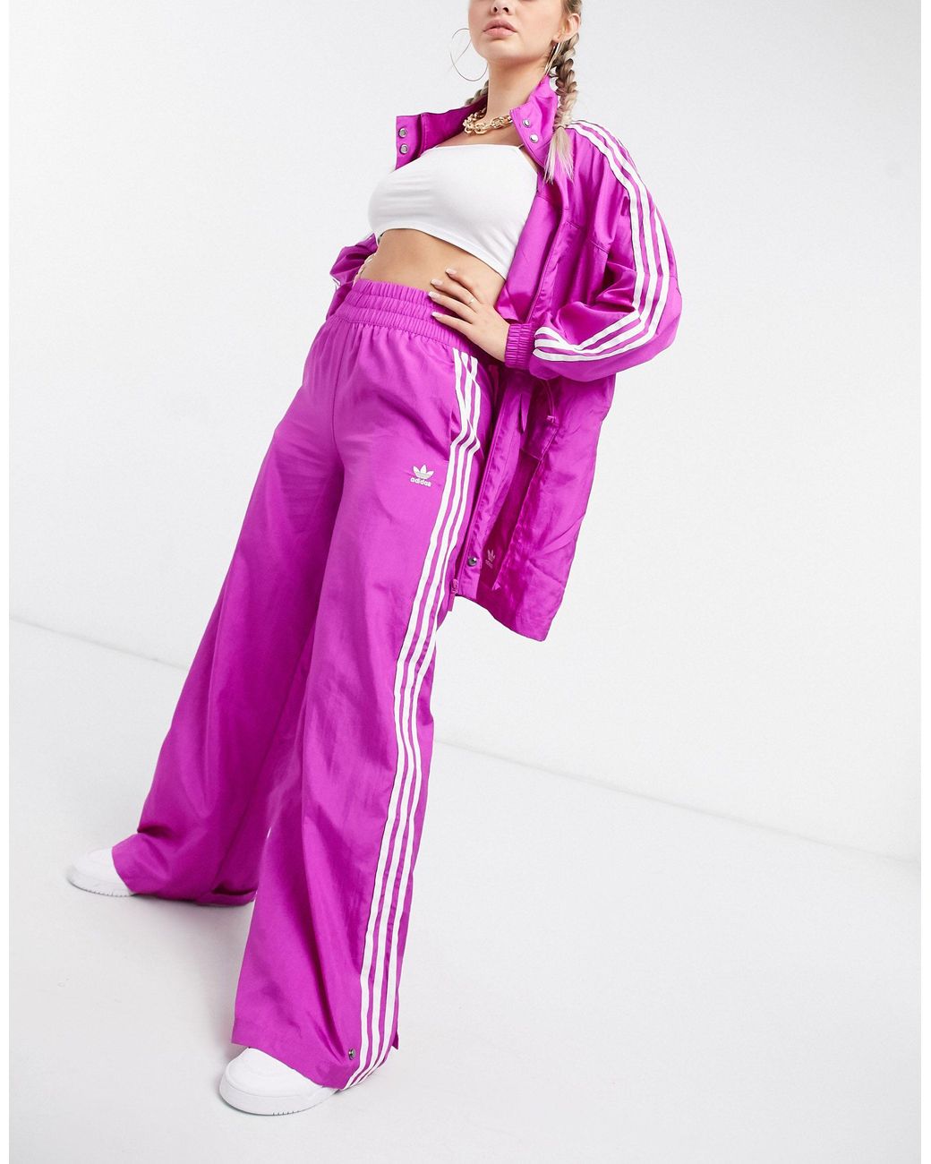 Communistisch lichtgewicht Accommodatie adidas Originals – Bellista – Weite Hose mit drei Streifen in Pink | Lyst DE