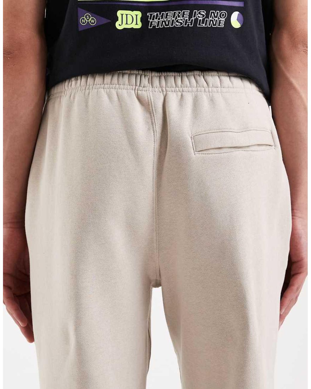 Nike White Athletic Club Graphic joggers for men
