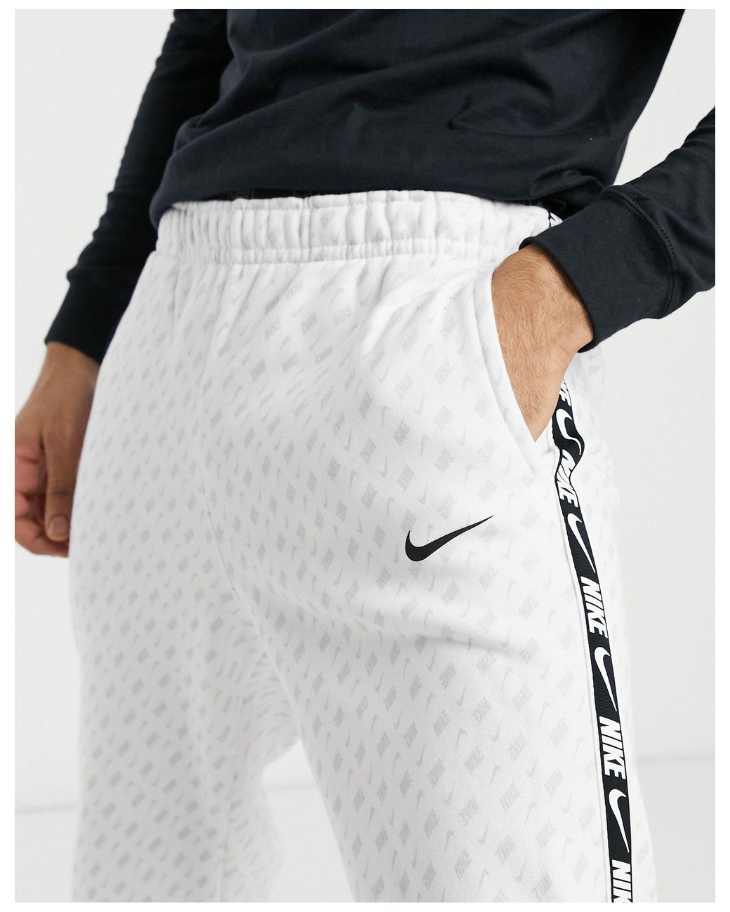 Nike Repeat Pack All over Logo Print Taping Cuffed Track Pants in White for Men Lyst UK