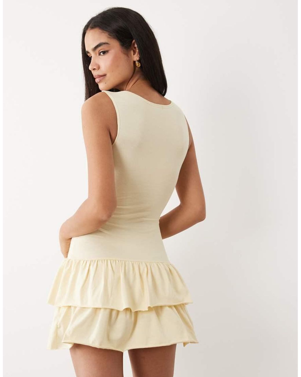 Fashionkilla Natural Exclusive Cotton Rich Sleeveless Drop Waist Ruffle Hem Mini Dress