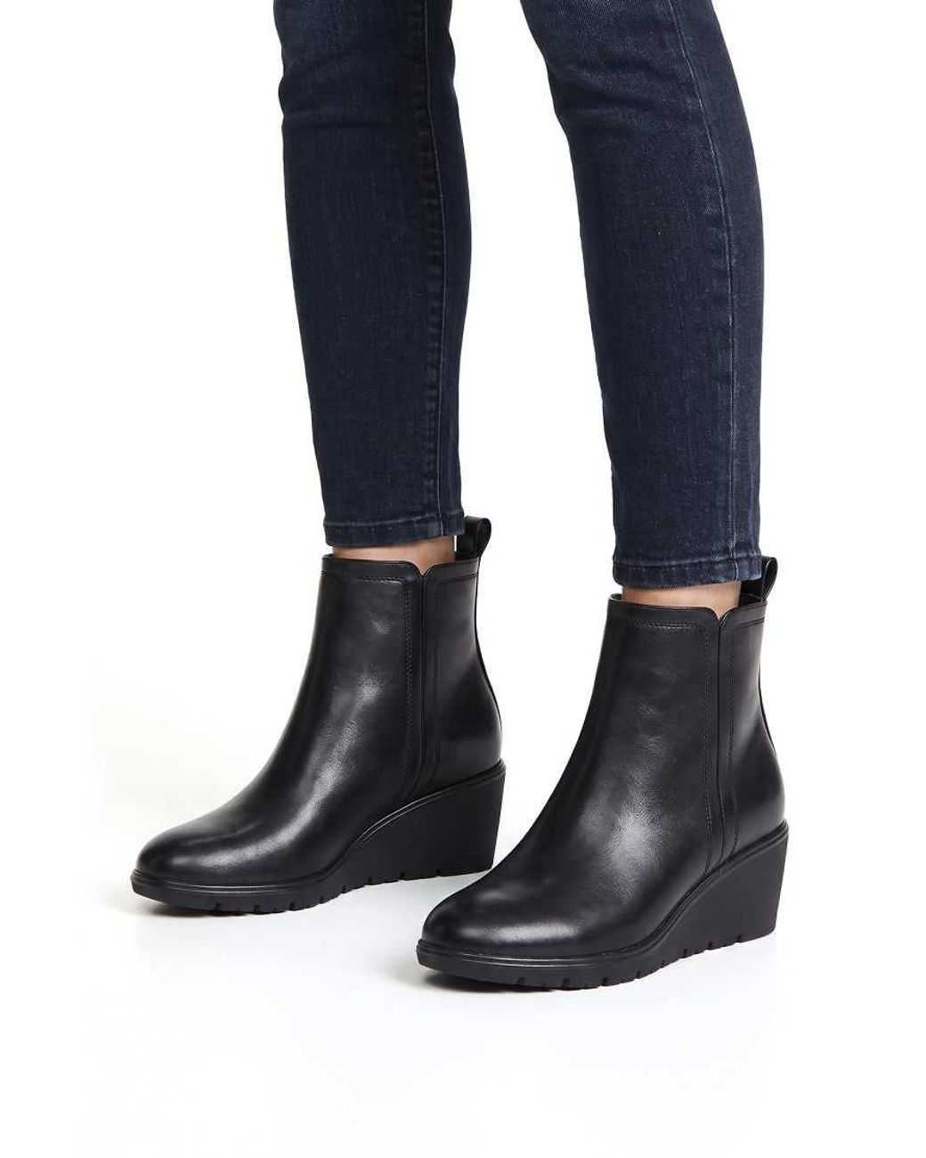 SEQWL Black Wedge Heel Ankle Booties With Cleated Sole And Pull Tab