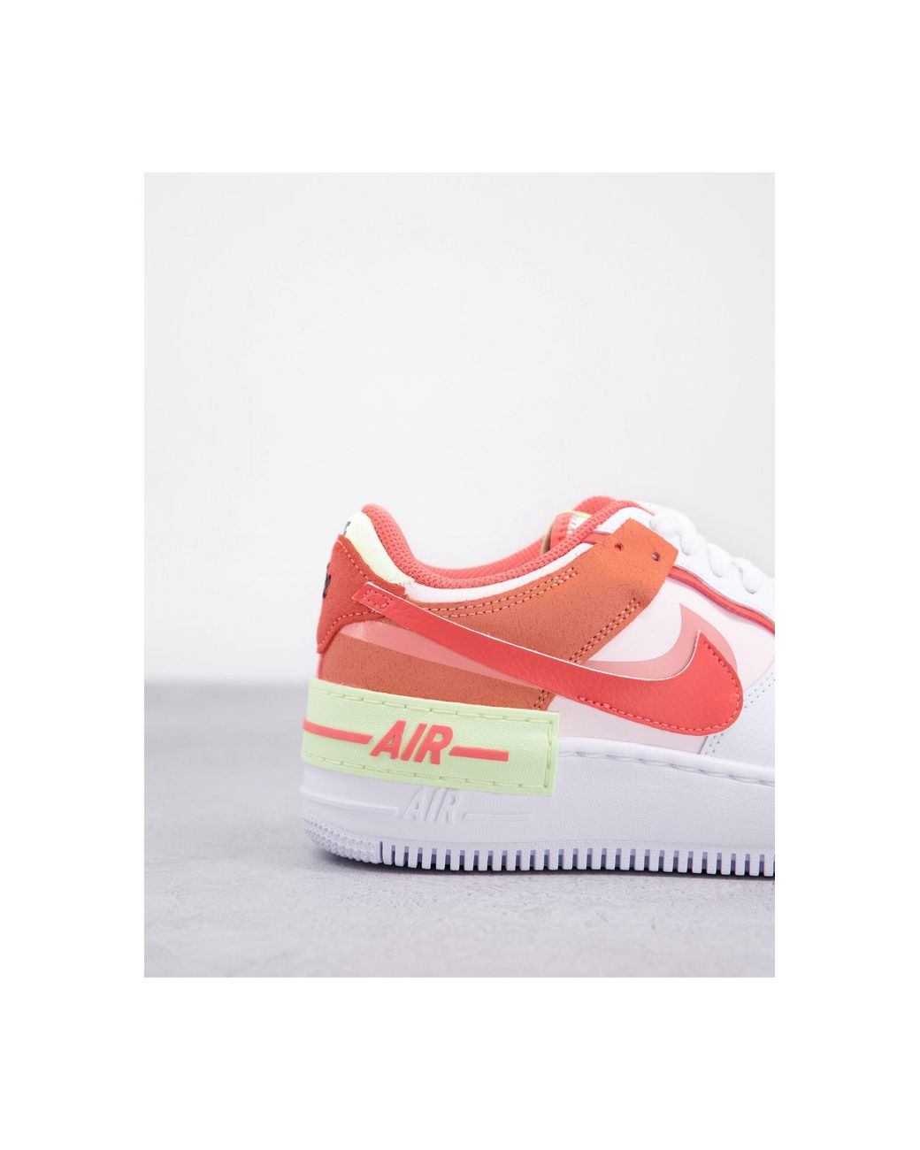 coral nike trainers