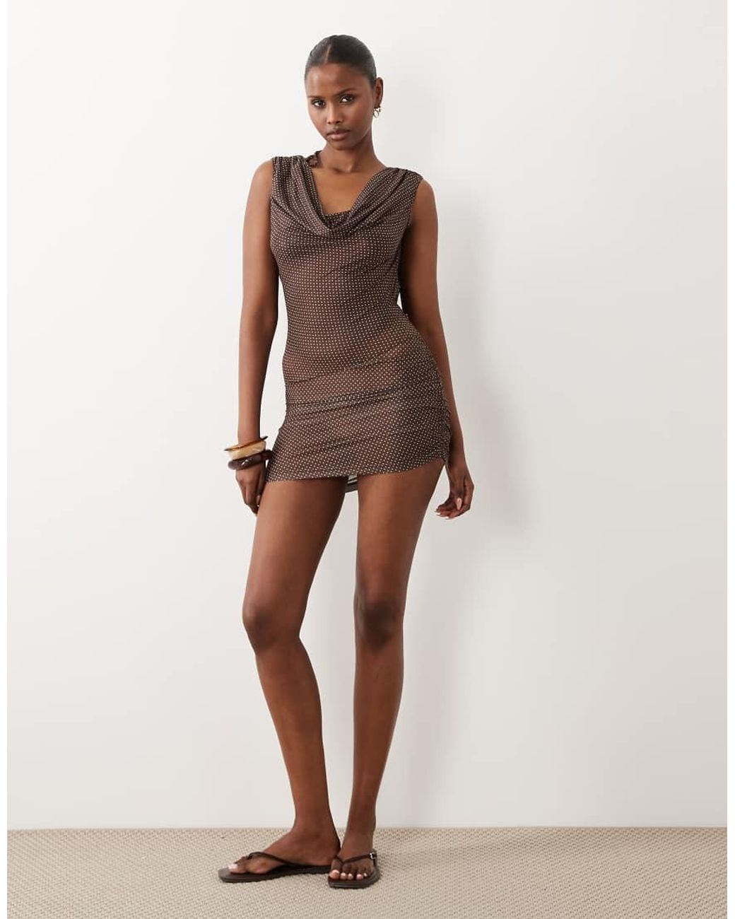 The Frolic Brown Exclusive Sheer Mesh Cowl Neck Open Back Beach Mini Dress