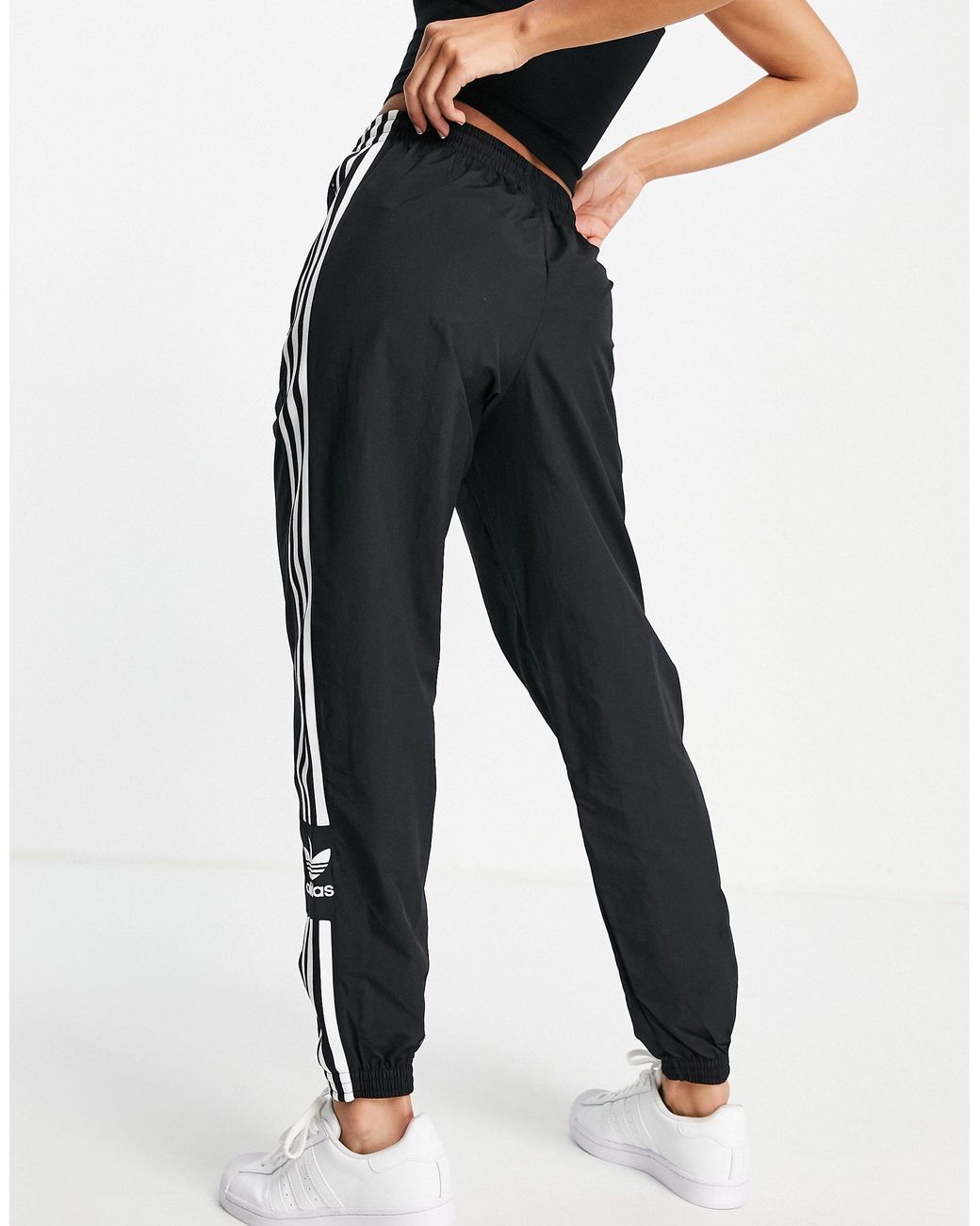 Adidas originals joggers with lock up logo black hotsell