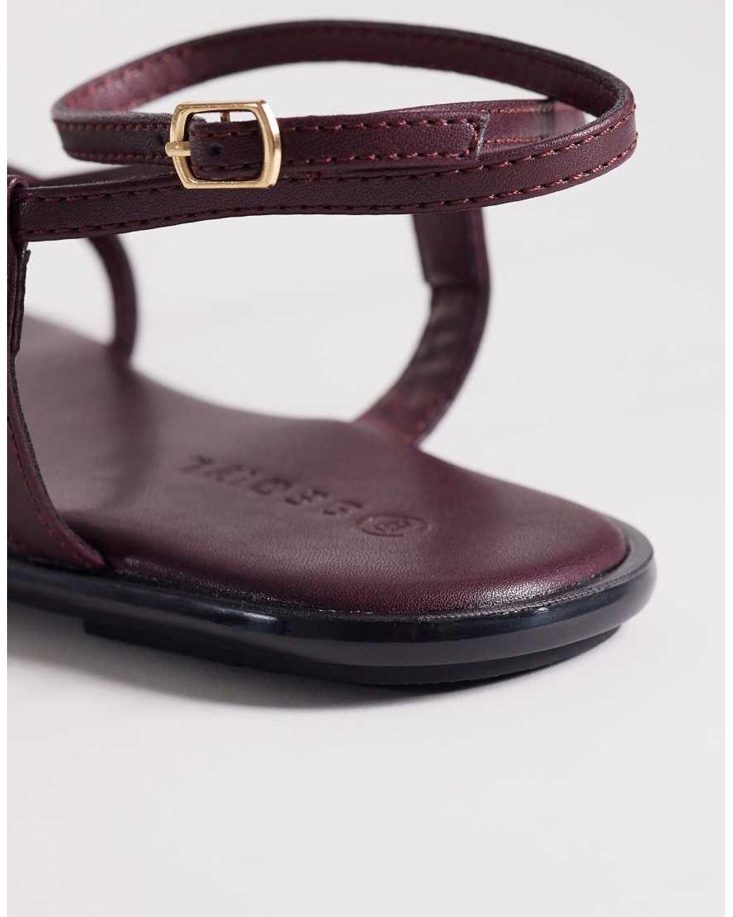 SEQWL Metallic Strappy Flat Sandals With Gold Embellishment