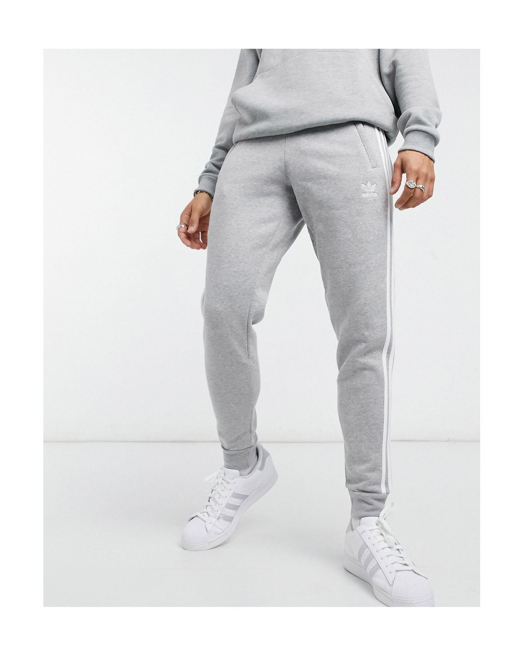 adidas Originals – adicolor – eng geschnittene jogginghose mit den drei  streifen in Grau für Herren | Lyst DE