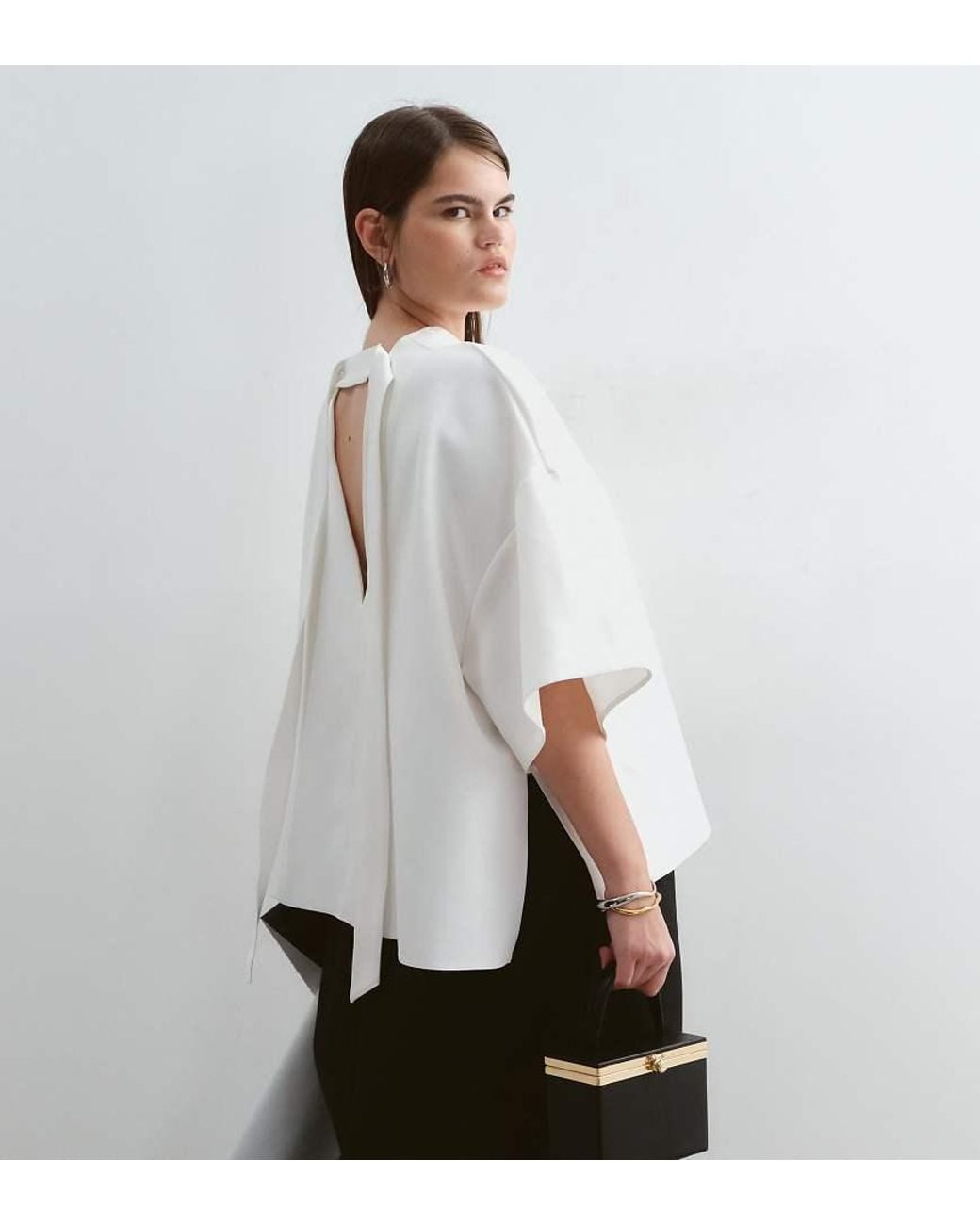ARRANGE White Curve Boxy Top With Open Back