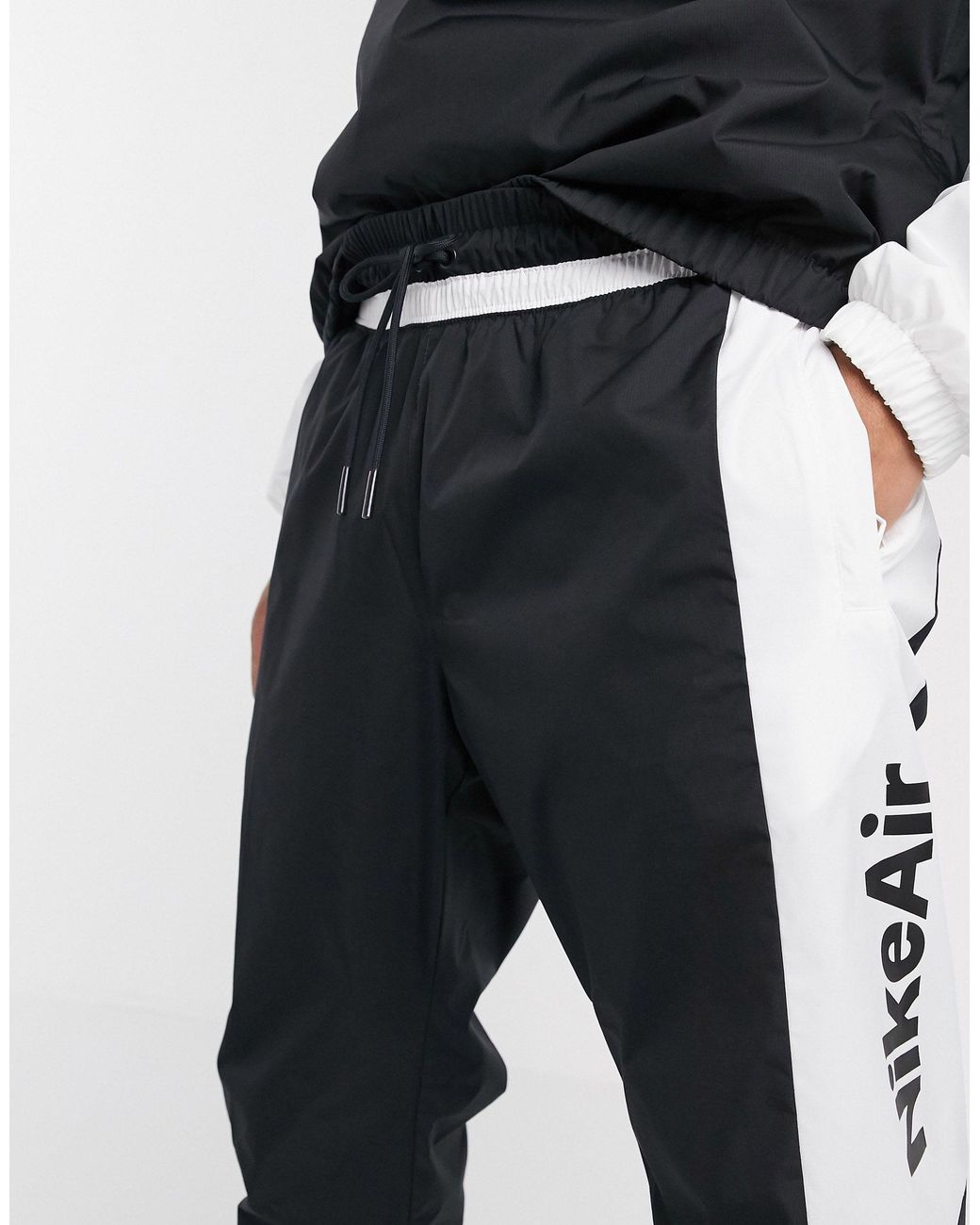 Nike Air Cuffed Woven joggers in Black for Men Lyst UK
