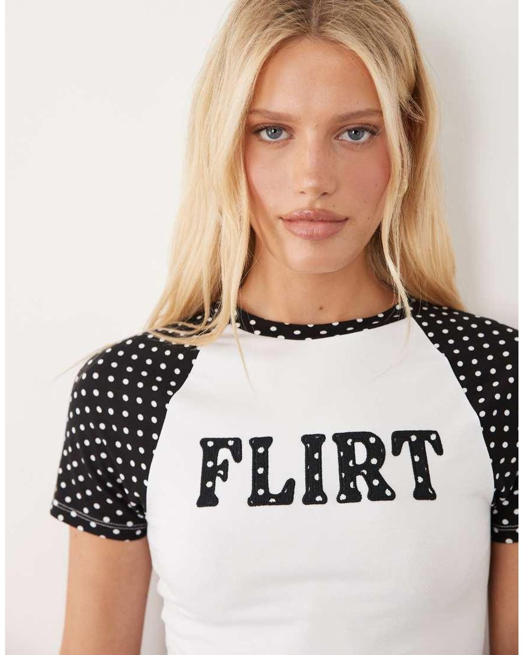 ASOS White Contrast Raglan Sleeve Baby Tee With Flirt Slogan