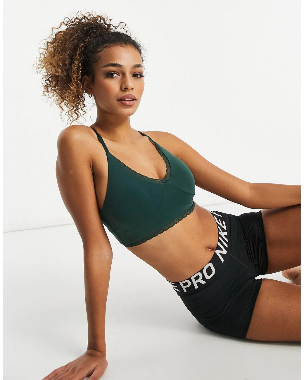 Nike Nike Yoga Indy Luxe Light Support Lace Sports Bra in Green | Lyst
