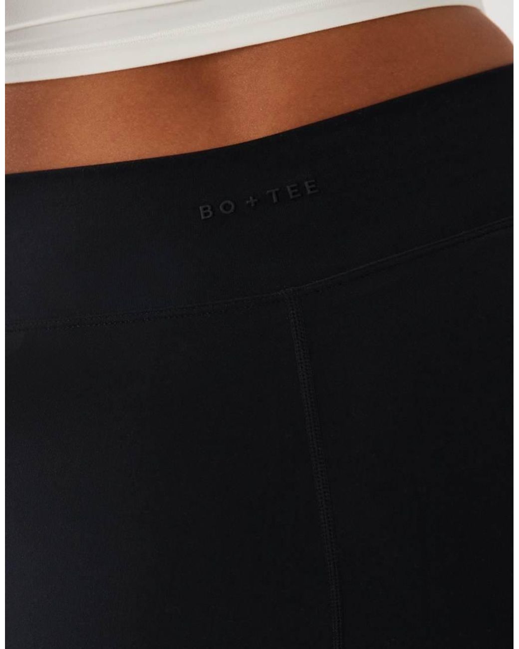 BO+TEE White Cross Over Waistband Flare Leggings