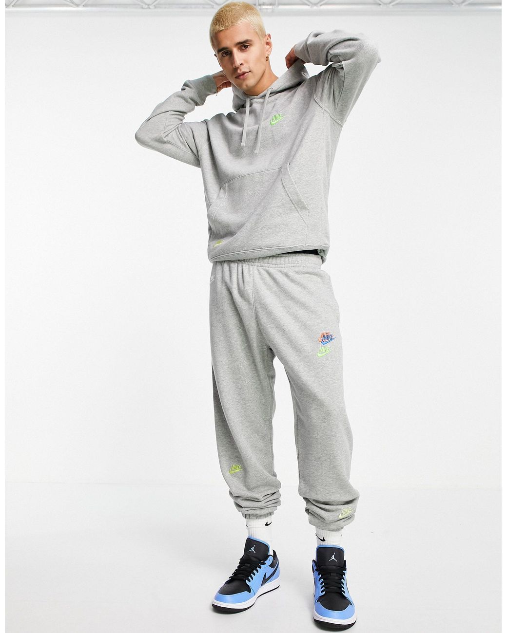 Nike Essential Fleece+ Multi Logo Casual Fit Cuffed Sweatpants in Grey for  Men | Lyst UK
