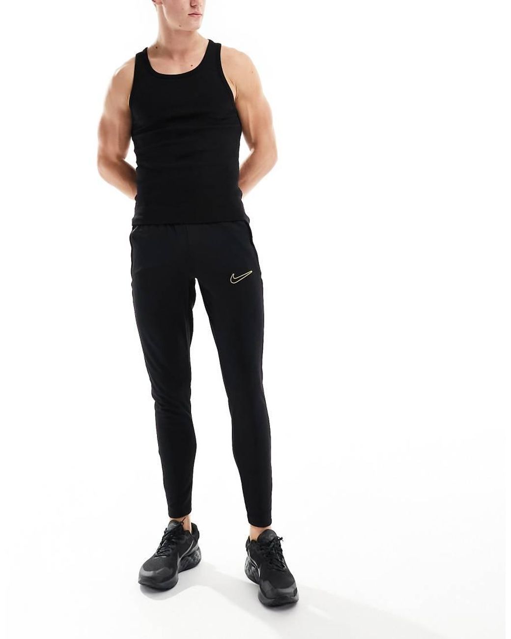 Nike football academy tapered joggers in black sale