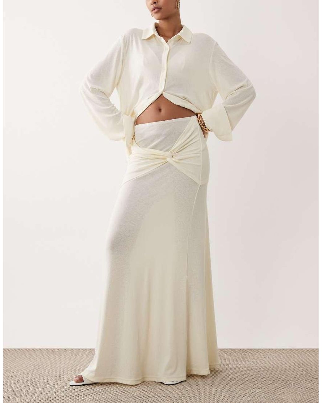 SNDY'S Natural Soft Fine Knit Semi Sheer Ruched Twist Front Detail Maxi Skirt