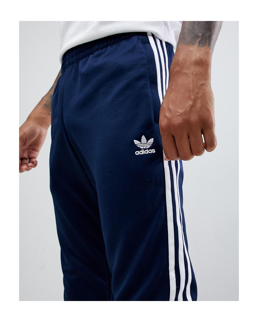 adidas Originals Three Stripe Skinny Sweatpants With Cuffed Hem in Blue for  Men | Lyst