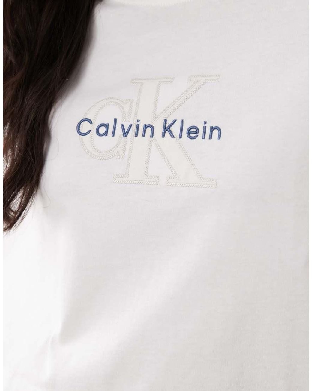 Calvin Klein White Monologo Cropped T-Shirt With Denim Applique Logo