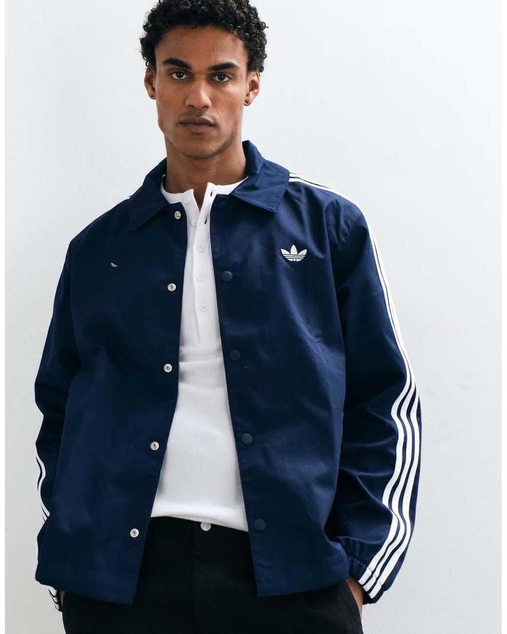 Adidas Originals Blue Three Stripe Coach Jacket for men