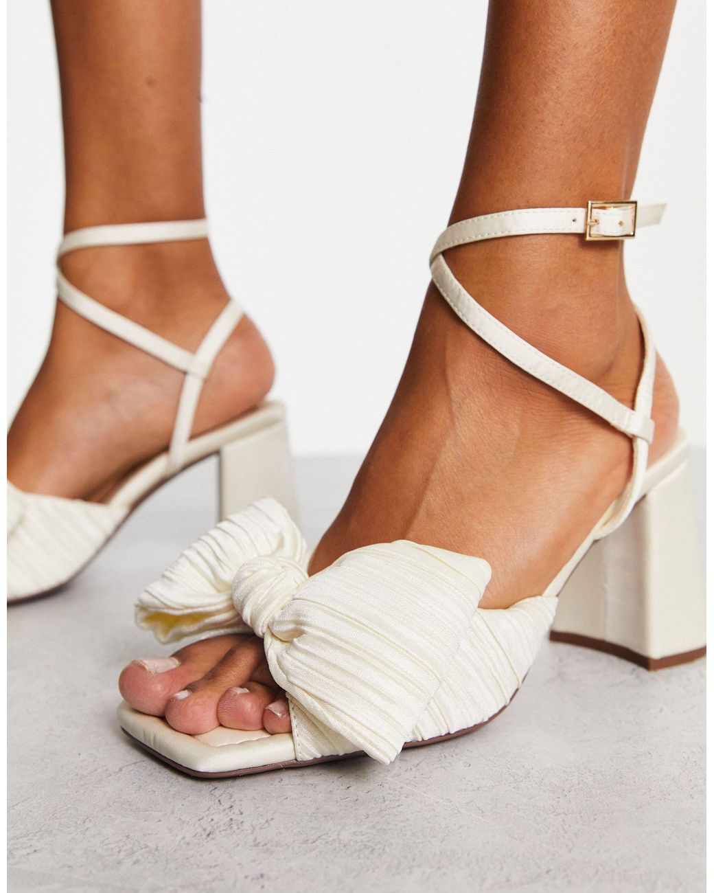 ASOS Design Hitched Bow Detail Mid Heeled Sandals in Gold