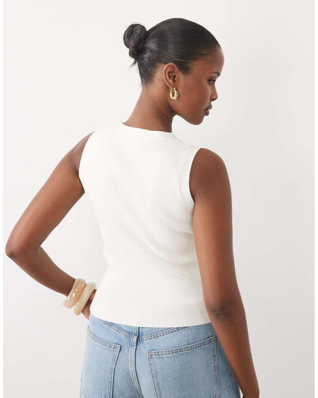 The Frolic Blue Exclusive Sleeveless Asymmetric Button Knitted Top