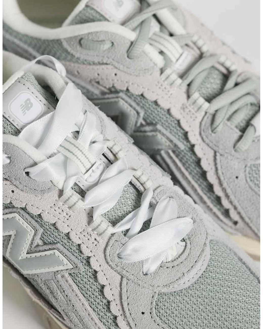 New Balance White 204L Scallop Trainers