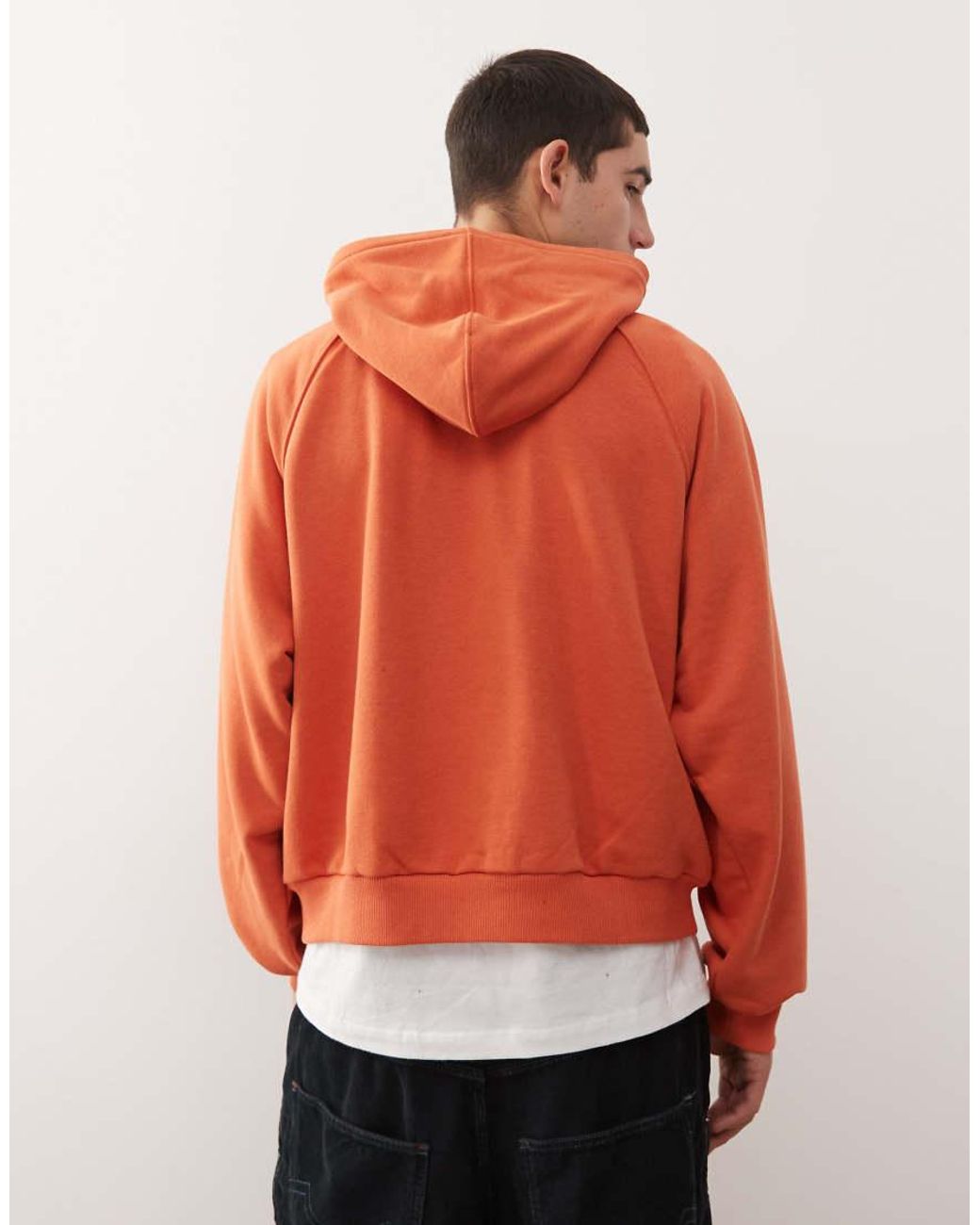 Reclaimed Vintage Orange Raglan Sleeve Oversized Hoodie With Graphic for men