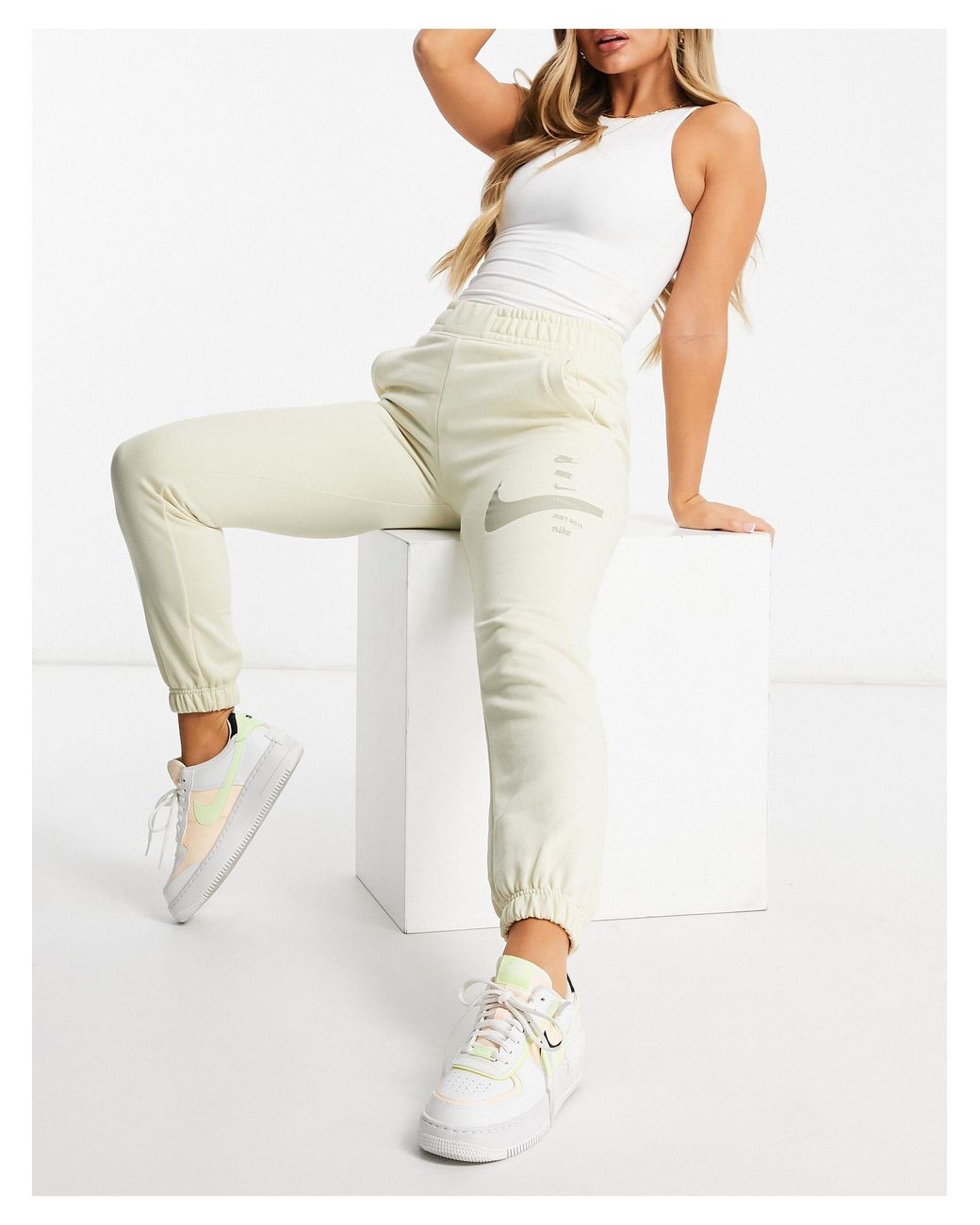 Nike High Waisted Swoosh joggers in Natural | Lyst Australia