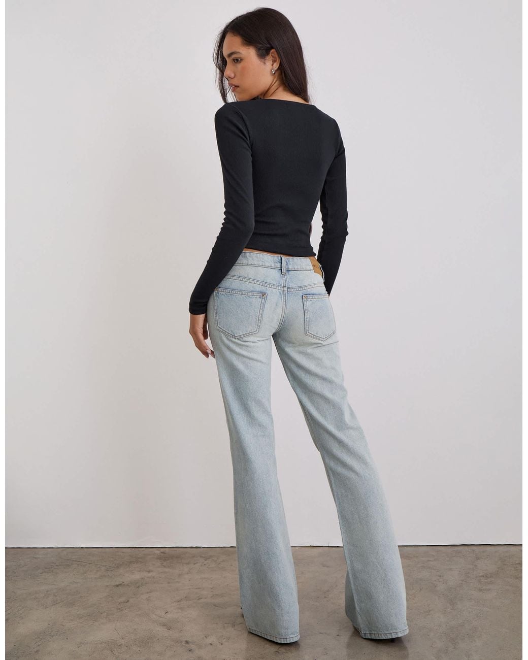 Motel Extra Low Rise Flare Jeans in White | Lyst