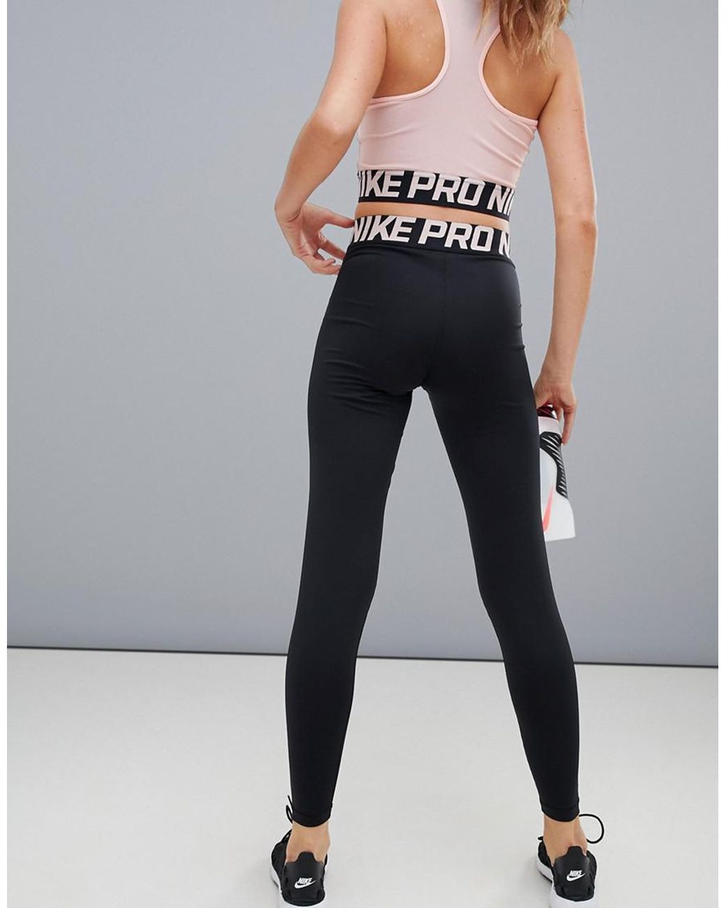Nike Nike Pro Training Crossover Leggings In Black And Pink | Lyst UK