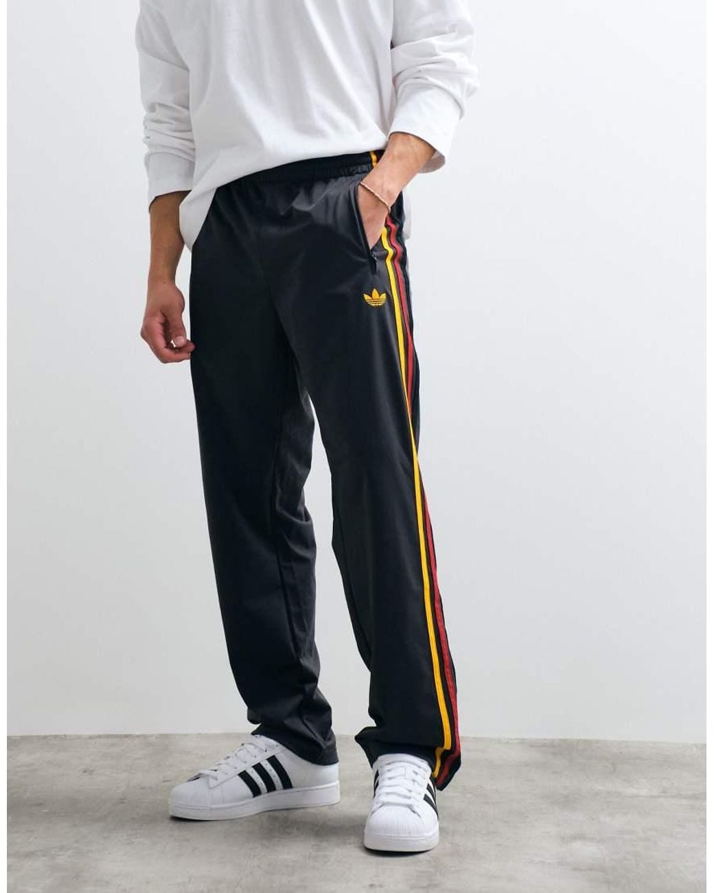 Adidas Originals Black Firebird Track Pants for men