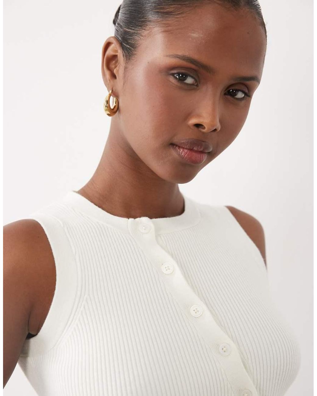 The Frolic Blue Exclusive Sleeveless Asymmetric Button Knitted Top